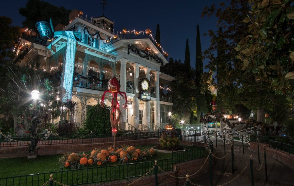 Haunted Mansion Holiday during Halloween Time at Disneyland Park features a merry makeover of the beloved eerie estate. 